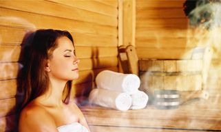 lady enjoys a steam room session as part of her thermotherapy programme