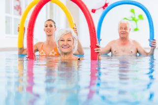 Three people of different ages participate in exercise programmes within the framework of balneotherapy